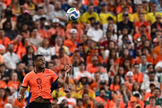 Netherlands' forward #11 Cody Gakpo jumps for the ball   during the 2026 World Cup Group F football match between the Netherlands and Sweden at the Houston Stadium in Houston on June 20, 2026.  (Photo by Paul ELLIS / AFP)