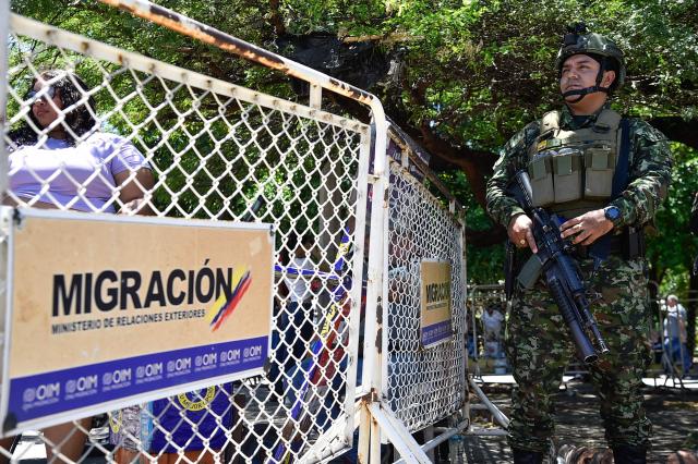 A Colombian soldier stands guard at the Simon Bolivar International Bridge linking Colombia and Venezuela in Villa del Rosario, North Santander department, Colombia, on June 20, 2026, on the eve of the presidential election runoff. Colombians vote on June 21, 2026 in a presidential runoff pitting a hard-right opera-singer-turned-lawyer against a leftist senator, an election with stark consequences for the country's stumbling peace process with armed groups and strained ties with Washington. (Photo by Schneyder Mendoza / AFP)