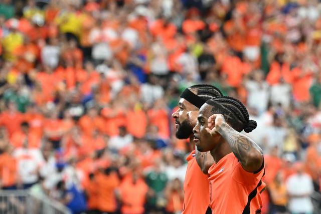 Netherlands' forward #24 Crysencio Summerville (R) celebrates with Netherlands' forward #10 Memphis Depay after scoring a goal during the 2026 World Cup Group F football match between the Netherlands and Sweden at the Houston Stadium in Houston on June 20, 2026.  (Photo by RONALDO SCHEMIDT / AFP)