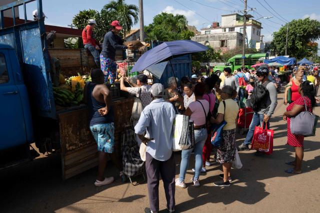 Residents purchase food and other goods at a neighbourhood market in Playa municipality, Havana, on June 20, 2026. (Photo by Pablo PORCIUNCULA / AFP)