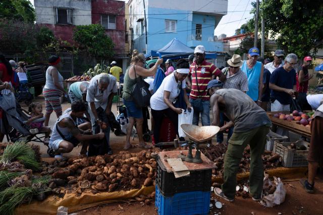 Residents purchase food and other goods at a neighbourhood market in Playa municipality, Havana, on June 20, 2026. (Photo by Pablo PORCIUNCULA / AFP)