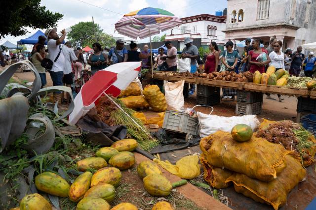 Residents purchase food and other goods at a neighbourhood market in Playa municipality, Havana, on June 20, 2026. (Photo by Pablo PORCIUNCULA / AFP)