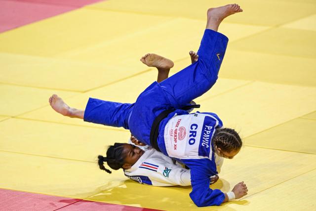 France's Kaila Issoufi (white) and Croatia's Petrunjela Pavic compete in the women's under 78kg preliminary bout at the Judo Ulaanbaatar Grand Slam 2026 in Ulaanbaatar on June 21, 2026. (Photo by ADEK BERRY / AFP)