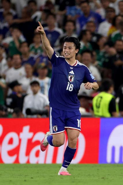 Japan's forward #18 Ayase Ueda celebrates after scoring his team second goal during the 2026 World Cup Group F football match between Tunisia and Japan at the Monterrey Stadium in Guadalupe, Mexico, on June 20, 2026.  (Photo by Julio Cesar AGUILAR / AFP)