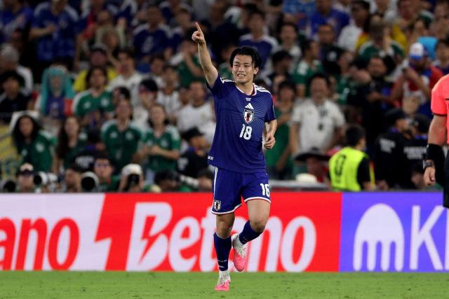 Japan's forward #18 Ayase Ueda celebrates after scoring his team second goal during the 2026 World Cup Group F football match between Tunisia and Japan at the Monterrey Stadium in Guadalupe, Mexico, on June 20, 2026.  (Photo by Julio Cesar AGUILAR / AFP)