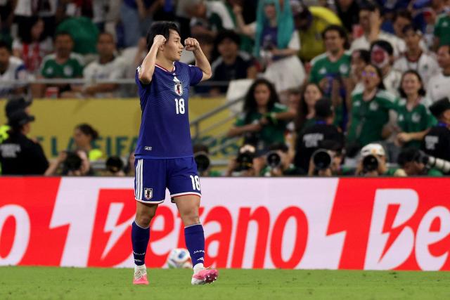 Japan's forward #18 Ayase Ueda celebrates after scoring his team second goal during the 2026 World Cup Group F football match between Tunisia and Japan at the Monterrey Stadium in Guadalupe, Mexico, on June 20, 2026.  (Photo by Julio Cesar AGUILAR / AFP)