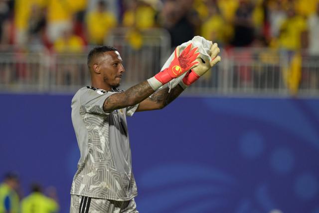 Curacao's goalkeeper #01 Eloy Room celebrates at the end of the 2026 World Cup Group E football match between Ecuador and Curacao at the Kansas City Stadium in Kansas City on June 20, 2026.  (Photo by JUAN MABROMATA / AFP)