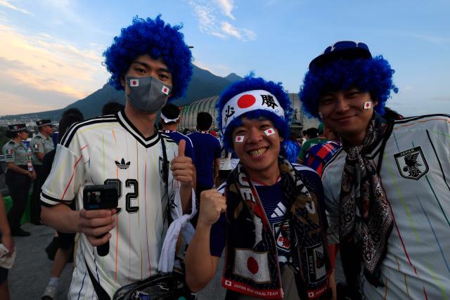 Japanese fans pose for a photo upon arriving to the 2026 World Cup Group F football match between Tunisia and Japan at the Monterrey Stadium in Guadalupe, Mexico, on June 20, 2026.  (Photo by Julio Cesar AGUILAR / AFP)