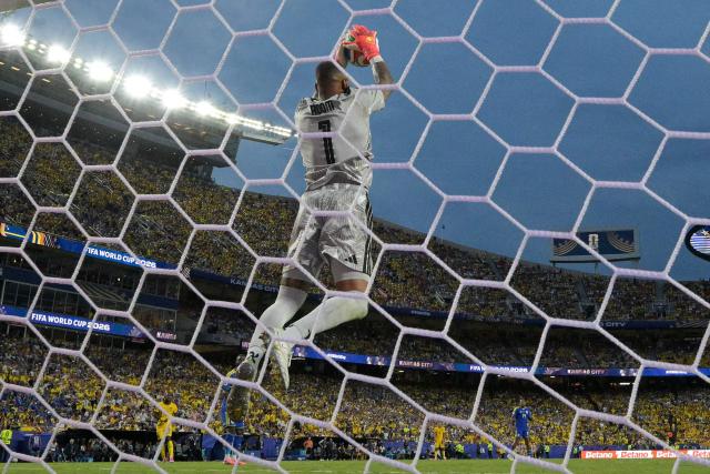 Curacao's goalkeeper #01 Eloy Room makes a save during the 2026 World Cup Group E football match between Ecuador and Curacao at the Kansas City Stadium in Kansas City on June 20, 2026.  (Photo by JUAN MABROMATA / AFP)