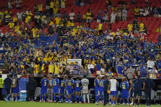 Curacao's players celebrate in front of their fans at the end of the 2026 World Cup Group E football match between Ecuador and Curacao at the Kansas City Stadium in Kansas City on June 20, 2026.  (Photo by JUAN MABROMATA / AFP)