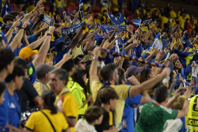 Curacao's fans celebrate at the end of the 2026 World Cup Group E football match between Ecuador and Curacao at the Kansas City Stadium in Kansas City on June 20, 2026.  (Photo by JUAN MABROMATA / AFP)