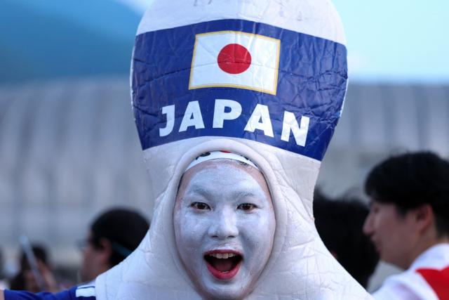 A Japanese fan, wearing a costume, poses for a photo upon arriving to the 2026 World Cup Group F football match between Tunisia and Japan at the Monterrey Stadium in Guadalupe, Mexico, on June 20, 2026.  (Photo by Julio Cesar AGUILAR / AFP)