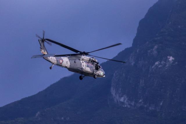 A Mexican Air Force helicopter patrols around the stadium ahead of the 2026 World Cup Group F football match between Tunisia and Japan at the Monterrey Stadium in Guadalupe, Mexico, on June 20, 2026.  (Photo by Julio Cesar AGUILAR / AFP)