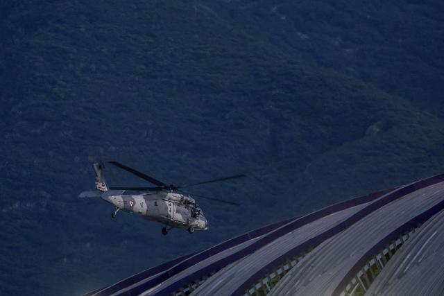 A Mexican Air Force helicopter patrols above the stadium ahead of the 2026 World Cup Group F football match between Tunisia and Japan at the Monterrey Stadium in Guadalupe, Mexico, on June 20, 2026.  (Photo by Julio Cesar AGUILAR / AFP)