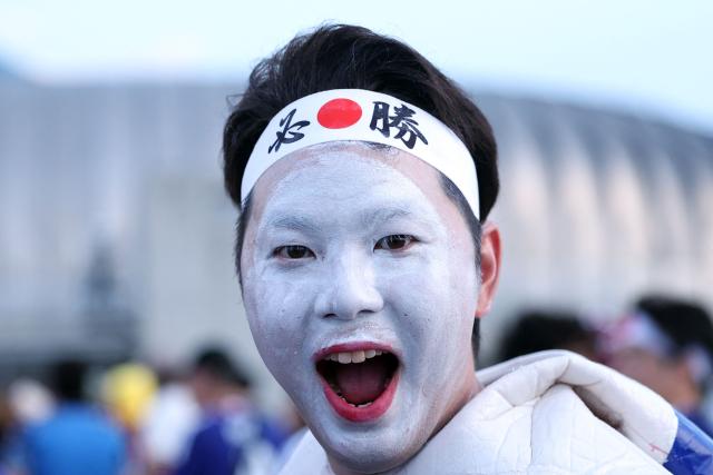 A Japanese fan cheers upon arriving to the 2026 World Cup Group F football match between Tunisia and Japan at the Monterrey Stadium in Guadalupe, Mexico, on June 20, 2026.  (Photo by Julio Cesar AGUILAR / AFP)