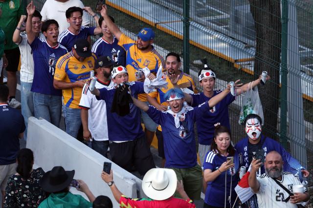 Fans cheer upon arriving to the 2026 World Cup Group F football match between Tunisia and Japan at the Monterrey Stadium in Guadalupe, Mexico, on June 20, 2026.  (Photo by Julio Cesar AGUILAR / AFP)