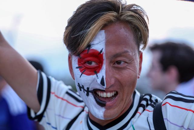 A Japanese fan cheers upon arriving to the 2026 World Cup Group F football match between Tunisia and Japan at the Monterrey Stadium in Guadalupe, Mexico, on June 20, 2026.  (Photo by Julio Cesar AGUILAR / AFP)