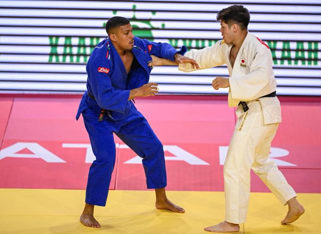 Japan's Sanshiro Murao (white) and Italy's Kenny Komi Bedel compete in the men's under 90kg preliminary bout at the Judo Ulaanbaatar Grand Slam 2026 in Ulaanbaatar on June 21, 2026. (Photo by ADEK BERRY / AFP)
