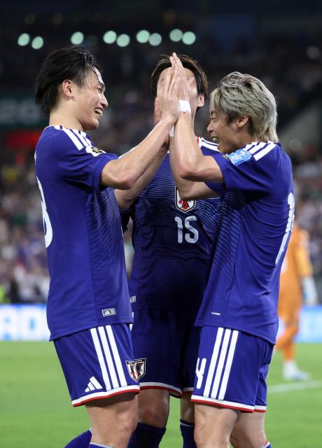 Japan's midfielder #14 Junya Ito (R) celebrates with Japan's forward #18 Ayase Ueda and Japan's midfielder #15 Daichi Kamada after scoring his team third goal during the 2026 World Cup Group F football match between Tunisia and Japan at the Monterrey Stadium in Guadalupe, Mexico, on June 20, 2026.  (Photo by Julio Cesar AGUILAR / AFP)
