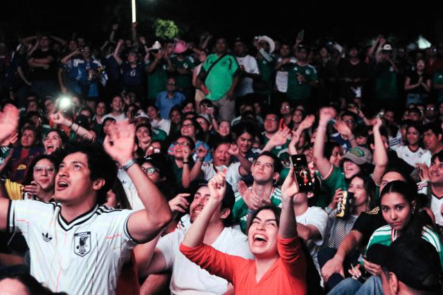 Football fans cheer while watching the 2026 World Cup Group F football match between Tunisia and Japan at a fan fest in Monterrey, Mexico, on June 20, 2026. (Photo by Julio Cesar SALAZAR / AFP)