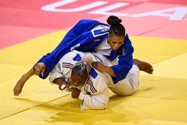 France's Dicko Romane (white) and compatriot Celia Cancan compete in the women's +78kg quarter-final bout at the Judo Ulaanbaatar Grand Slam 2026 in Ulaanbaatar on June 21, 2026. (Photo by ADEK BERRY / AFP)