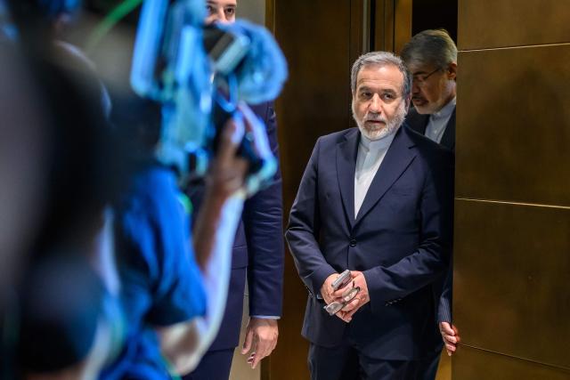 Iran's Foreign Minister Abbas Araghchi arrives for a bilateral meeting with Switzerland's counterpart at the Burgenstock luxury hotel complex overlooking Lake Lucerne, Switzerland, on June 21, 2026, ahead of high-level talks aimed at advancing a deal to end the Middle East conflict. A new round of negotiations over the Middle East war was set to kick off on June 21, 2026 with Iranian negotiators arriving in the Swiss host city hours ahead of US Vice President JD Vance, even as Tehran said it was closing the Strait of Hormuz again over Israeli attacks in Lebanon. (Photo by Fabrice Coffrini / POOL / AFP)