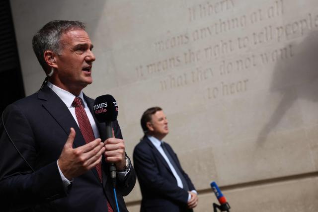 Britain's Business Secretary Peter Kyle (L) and Britain's main opposition Conservative Party Shadow Chancellor of the Exchequer, Mel Stride  (R) speak to members of the media outside the BBC in central London on June 21, 2026, after appearing on the BBC's 'Sunday' political television show, amid reports that Britain's Prime Minister Keir Starmer is planning to announce his resignation. (Photo by Adrian DENNIS / AFP)