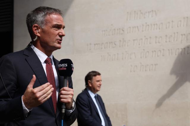 Britain's Business Secretary Peter Kyle (L) and Britain's main opposition Conservative Party Shadow Chancellor of the Exchequer, Mel Stride  (R) speak to members of the media outside the BBC in central London on June 21, 2026, after appearing on the BBC's 'Sunday' political television show, amid reports that Britain's Prime Minister Keir Starmer is planning to announce his resignation. (Photo by Adrian DENNIS / AFP)