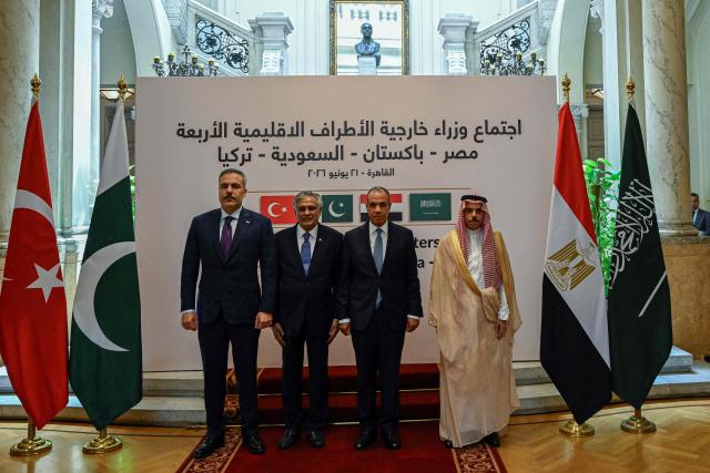 From (L-R) Turkey's Foreign Minister Hakan fidan, Pakistan's Foreign Minister Ishaq Dar, Egypt's Foreign Minister Badr Abdel Ati, and Saudi Foreign Minister Faisal bin Farhan pose for a picture ahead of a meeting in Cairo on June 21, 2026. Pakistan's foreign ministry said on June 19 that the four-way meeting would bring together the foreign ministers of Pakistan, Saudi Arabia, Turkey and Egypt to "discuss regional developments and exchange views on issues related to peace, security and stability". (Photo by Khaled DESOUKI / AFP)