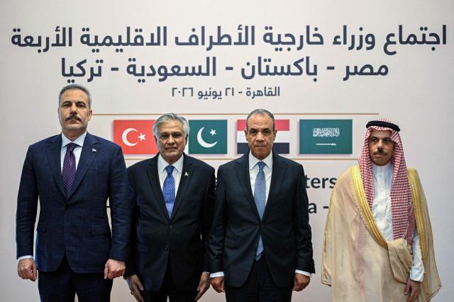 From (L-R) Turkey's Foreign Minister Hakan fidan, Pakistan's Foreign Minister Ishaq Dar, Egypt's Foreign Minister Badr Abdel Ati, and Saudi Foreign Minister Faisal bin Farhan pose for a picture ahead of a meeting in Cairo on June 21, 2026. Pakistan's foreign ministry said on June 19 that the four-way meeting would bring together the foreign ministers of Pakistan, Saudi Arabia, Turkey and Egypt to "discuss regional developments and exchange views on issues related to peace, security and stability". (Photo by Khaled DESOUKI / AFP)