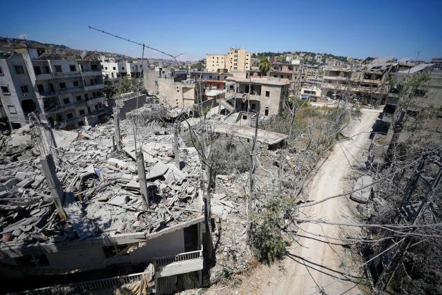 This picture shows heavily damaged buildings at the site of Lebanon's central bank building that was targeted in an Isreali strike the previous day in the southern Lebanese city of Nabatieh on June 21, 2026. (Photo by Abbas FAKIH / AFP) / 