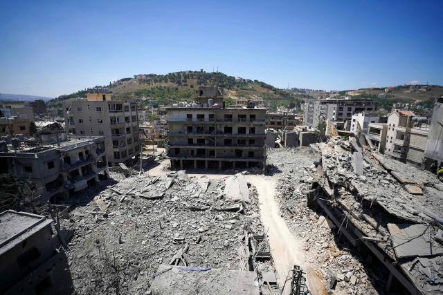 This picture shows heavily damaged buildings at the site of Lebanon's central bank building that was targeted in an Isreali strike the previous day in the southern Lebanese city of Nabatieh on June 21, 2026. (Photo by Abbas FAKIH / AFP) / 