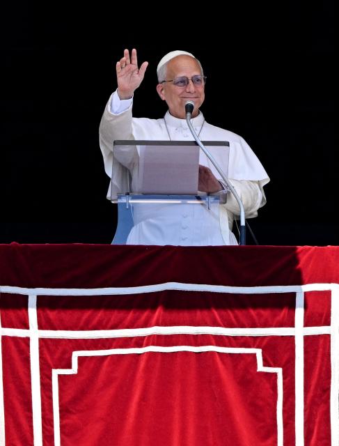 Pope Leo XIV blesses the crowd from a window of the apostolic palace overlooking St Peter's Square during the Angelus prayer in The Vatican on June 21, 2026. (Photo by TIZIANA FABI / AFP)
