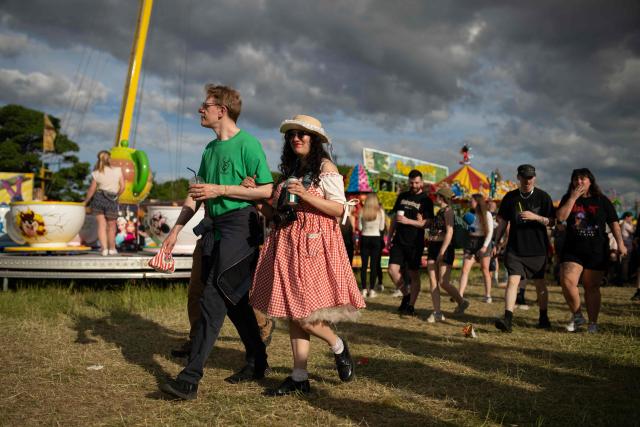 Members of the public attend The Hoppings fun fair, believed to be one of the largest travelling funfairs in Europe, in Newcastle upon Tyne, north east England on June 20, 2026. The fun fair, which originally began as a Temperance Fair in 1882, comprises of over 400 attractions set up on the city's Town Moor. The fair runs until June 28, 2026 and is expected to attract around 500,000 people. (Photo by Oli SCARFF / AFP)