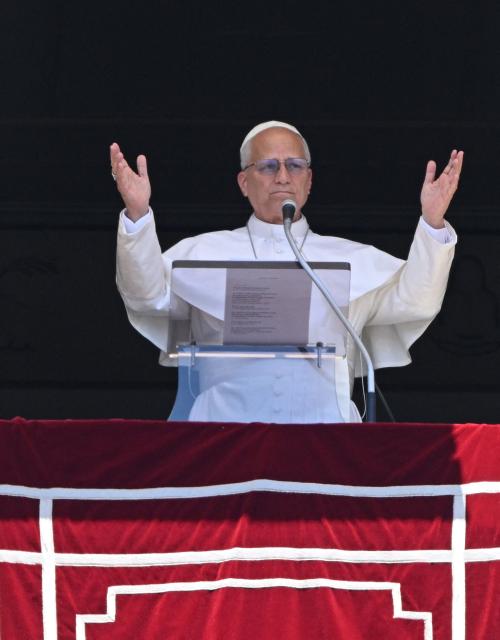 Pope Leo XIV blesses the crowd from a window of the apostolic palace overlooking St Peter's Square during the Angelus prayer in The Vatican on June 21, 2026. (Photo by TIZIANA FABI / AFP)