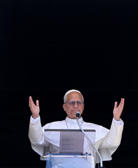 Pope Leo XIV blesses the crowd from a window of the apostolic palace overlooking St Peter's Square during the Angelus prayer in The Vatican on June 21, 2026. (Photo by TIZIANA FABI / AFP)