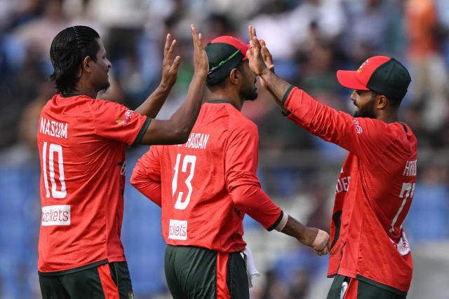 Bangladesh's Nasum Ahmed (L) celebrates with teammates after taking the wicket of Australia's Josh Inglis during the third Twenty20 (T20) international cricket match between Bangladesh and Australia at the Bir Sreshtho Flight Lieutenant Matiur Rahman Stadium in Chattogram on June 21, 2026. (Photo by AFP)