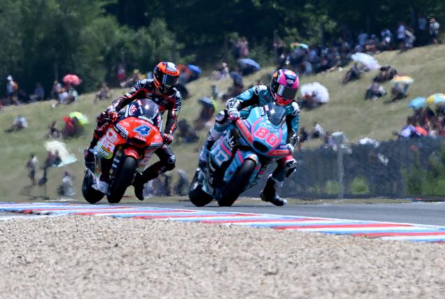 Team MT Helmets - MSi's Ivan Ortola (L) races to win the Moto2 event in front of Team CFMoto Aspar Racing Team's David Alonso (R) prior to the MotoGP Grand Prix of Czechia in Brno, Czech Republic, on June 21, 2026. (Photo by Michal Cizek / AFP)