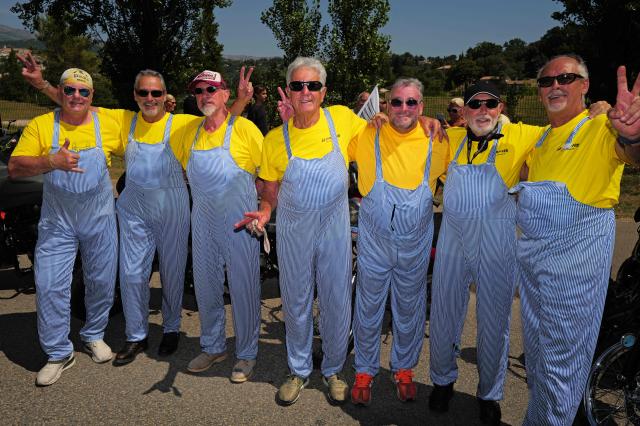 Attendees dressed up as Coluche pose as they take part in a "Run Coluche" biker gathering as part of a tribute to French comedian and actor Coluche 40 years after his death, in Opio, southeastern France, on June 21, 2026. (Photo by Valery HACHE / AFP)