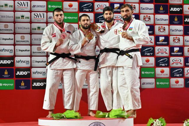 Gold medallist Gennaro Pirelli of Italy (2nd L), silver medallist Idar Bifov of Russia (L), bronze medallists Ilia Sulamanidze of Georgia (2nd R) and Zelym Kotsoiev of Azerbaijan pose for photos during the medal ceremony for the men's -100kg category at the Judo Ulaanbaatar Grand Slam 2026 in Ulaanbaatar on June 21, 2026. (Photo by ADEK BERRY / AFP)