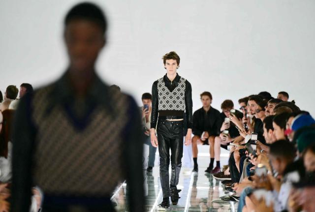 A model walks the runway during the Prada collection show as part of Spring/Summer 2027 men's collection at Milan Fashion Week, on June 21, 2026. (Photo by Stefano RELLANDINI / AFP)