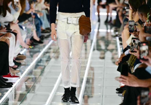 A model walks the runway during the Prada collection show as part of Spring/Summer 2027 men's collection at Milan Fashion Week, on June 21, 2026. (Photo by Stefano RELLANDINI / AFP)