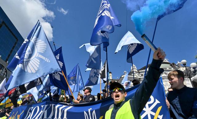 Far right demonstrators take part in a counter-rally against the Kyiv Pride March 2026 and in defense of "traditional values" in Kyiv on June 21, 2026, amid Russian invasion in Ukraine. (Photo by Sergei SUPINSKY / AFP)