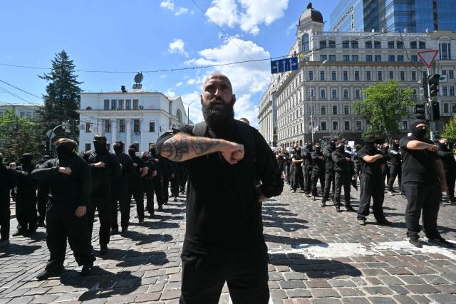 Far right demonstrators dressed in full black take part in a counter-rally against the Kyiv Pride March 2026 and in defense of "traditional values" in Kyiv on June 21, 2026, amid Russian invasion in Ukraine. (Photo by Sergei SUPINSKY / AFP)