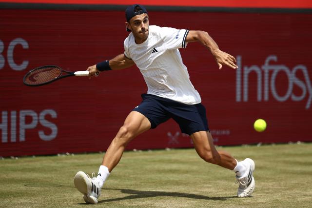 Argentina's Francisco Cerundolo returns to US player Tommy Paul during the men's singles final tennis match on day six of the ATP HSBC Championships at Queen's Club in west London on June 21, 2026. (Photo by Henry NICHOLLS / AFP)