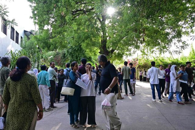 A medical student reacts after taking the NEET-UG re-examination in Ahmedabad on June 21, 2026. India's 2.2 million aspiring medical students sit a re-examination under tight security on June 21, after the last test was scrapped following a paper leak that triggered widespread outrage. (Photo by Shammi MEHRA / AFP)