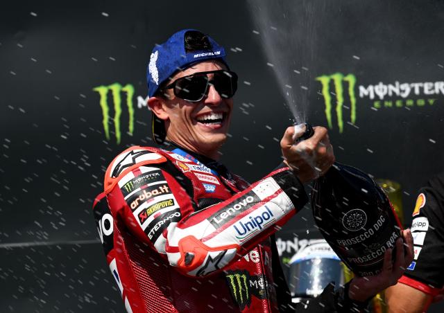 Team Ducati Lenovo Team's Marc Marquez celebrates on the podium with sparkling wine after winning the MotoGP Grand Prix of Czechia in Brno, Czech Republic, on June 21, 2026. (Photo by Michal Cizek / AFP)