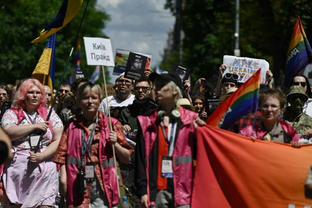 Demonstrators take part in the Kyiv Pride Equality March, a rally in support of the rights of LGBTQ+ community members, in Kyiv on June 21, 2026, amid the Russian invasion of Ukraine. (Photo by Genya SAVILOV / AFP)
