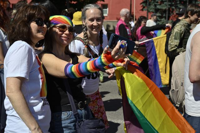Demonstrators take part in the Kyiv Pride Equality March, a rally in support of the rights of LGBTQ+ community members, in Kyiv on June 21, 2026, amid the Russian invasion of Ukraine. (Photo by Genya SAVILOV / AFP)