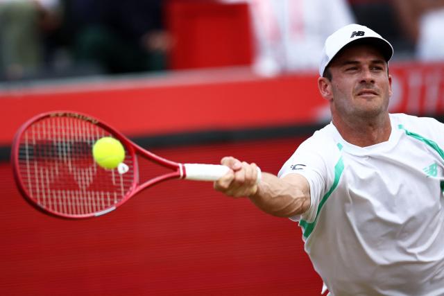 US player Tommy Paul returns to Argentina's Francisco Cerundolo during the men's singles final tennis match on day six of the ATP HSBC Championships at Queen's Club in west London on June 21, 2026. (Photo by Henry NICHOLLS / AFP)